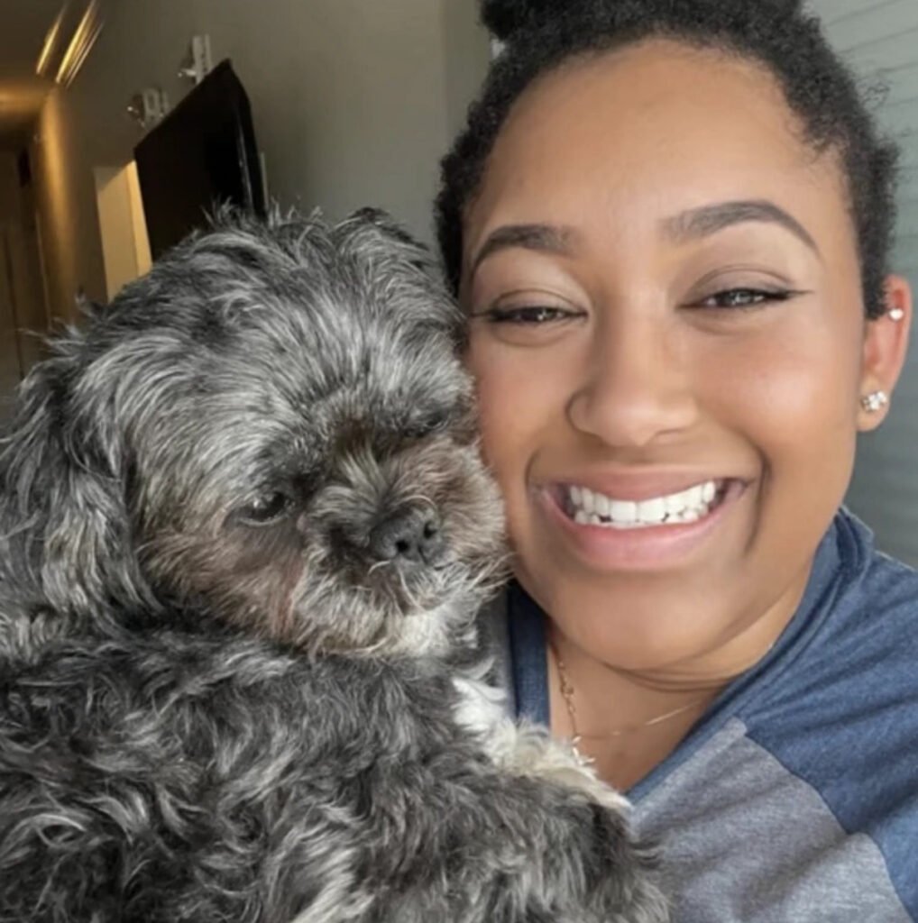 Portrait of Gabrie'le Eato with her dog